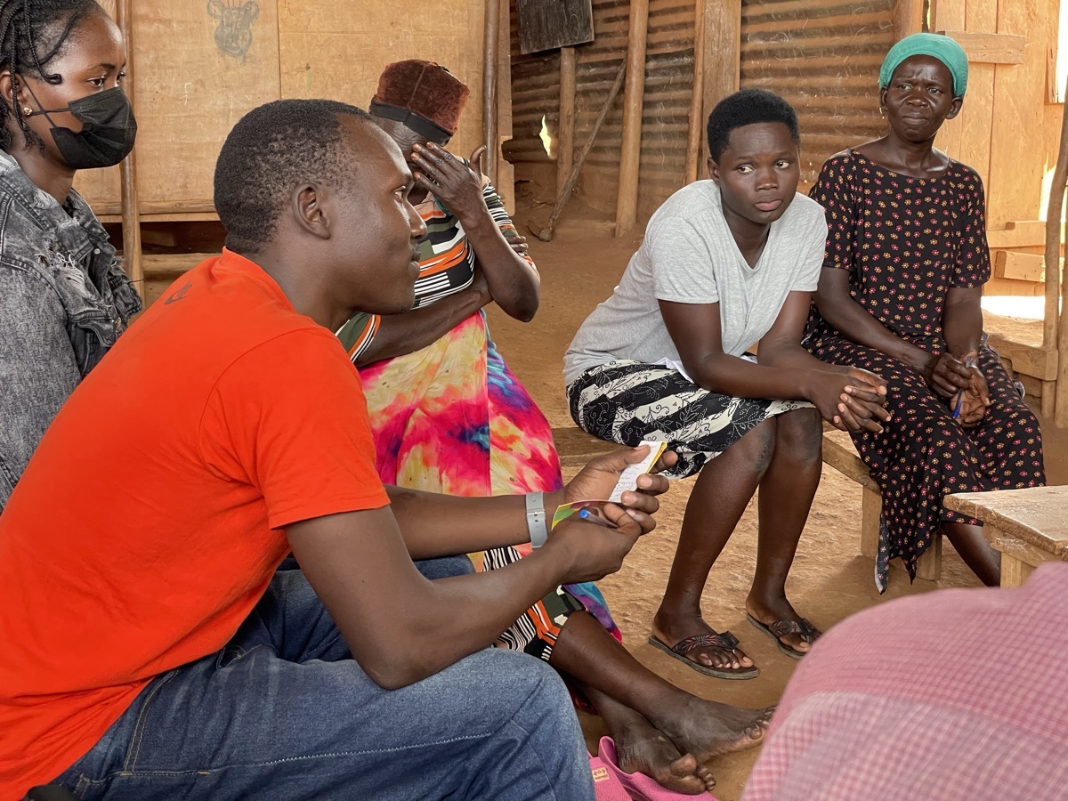 Caring Hands Uganda community meeting